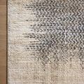 Top corner view of Wyatt Stone beige rug highlighting detailed weave and natural fiber look on wooden floor