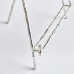 Close-up of Baldwin Easel’s lower frame joint and bamboo texture on a white background