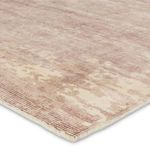 Close-up angled view showing plush texture and subtle color gradients of mauve and cream fibers