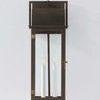Bohen sconce front view on plain light-colored wall with visible two candle-style bulbs inside