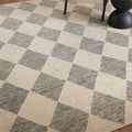 Closer look at Francis rug surface texture and color contrast between beige and charcoal wool fibers