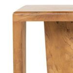 Detail of top edge and legs showing the smooth rounded finish and teak’s warm hue