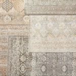 Top-down view of multiple overlapping vintage style rugs with the Hakeem rug layered on top