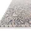 Close-up angle of Lucia Charcoal / Multi rug edge showing texture and pile height on white background