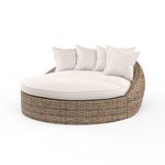 Havana Round Daybed with aged tobacco all-weather wicker base and plush off-white cushions and back pillows