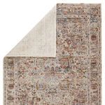 Revealed backside of rug folded diagonally showing the contrast between front pattern and plain underside
