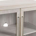Close-up on metal handles and glass door frame highlighting wood grain texture