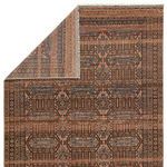 Back side view of Leone rug folded to reveal weaving and pattern