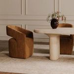 Side view of two Barrow chairs at dining table showing chair’s height and curved silhouette
