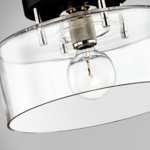 Close-up angled view showing textured metal socket and internal bulb details inside clear glass shade