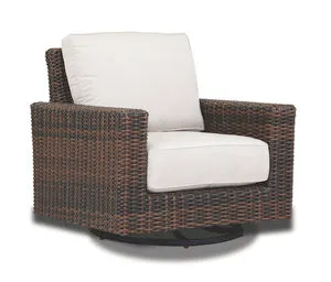 Montecito Swivel Rocker Club Chair with cognac multi-colored resin wicker and white cushions