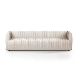 Cream-colored version of Augustine Sofa angled against white background with vertical channeling