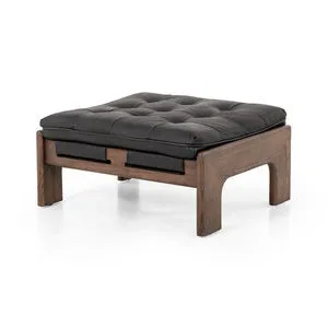 Black top grain leather ottoman with tufted cushion and wide ash wood frame with sling detail