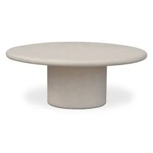 Round outdoor coffee table with hand-finished textured concrete top and bold cylindrical pedestal base in light gray