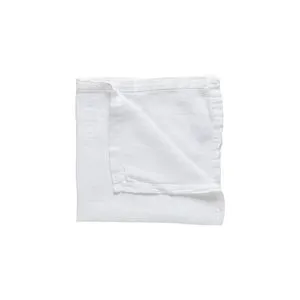 Chalk white linen runner folded, showing soft texture and simple stitched hem in natural linen fabric