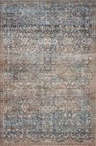 Jules Denim / Spice rug with vintage-inspired floral medallion pattern in blue, beige, and rust tones