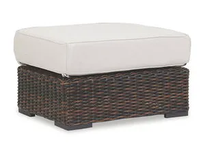 Montecito Ottoman with Cognac multi-colored woven resin wicker base and thick white outdoor cushion