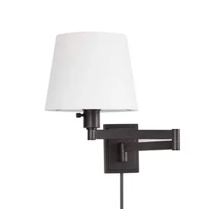 Traditional task sconce with a white tapered fabric shade and adjustable black metal arm and backplate