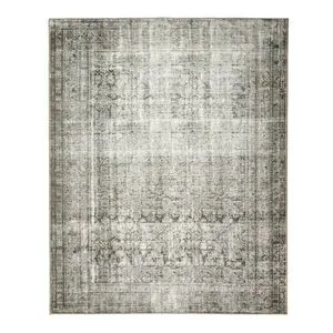 Nala Sage Olive Rug with a vintage-inspired faded floral pattern in sage green and olive on a muted beige background