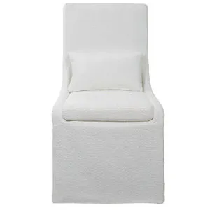 Coley Armless Chair with crisp white heavily textured polyester slipcover, plush cushion seat, and kidney pillow