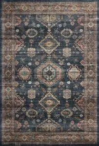Traditional Anniston Denim Sunset Rug with distressed blue base and muted orange, beige geometric motifs