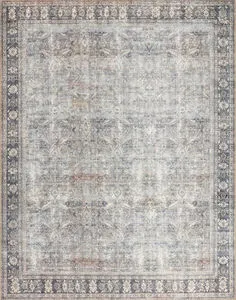 Rectangular grey and charcoal rug with distressed vintage floral border and medallion pattern