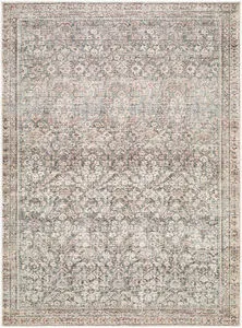 Collins Avenue Rust/Green Machine woven rug with intricate vintage floral pattern in muted rust, green, and beige tones