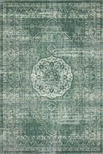 Rectangular green and mist patterned rug with abstract tribal-inspired medallion design and textured yarn