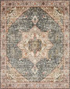 Traditional rectangular rug with blue-gray center medallion, cream and rust floral motifs, distressed look.