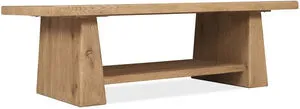 Rectangular cocktail table in warm Buckboard oak finish with double pedestal base and fixed lower shelf