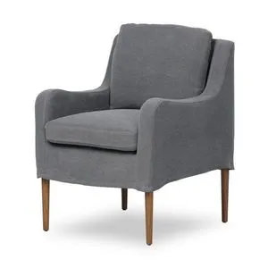 Aurelia Dining Chair angled view showing fluid frame shape and wooden legs