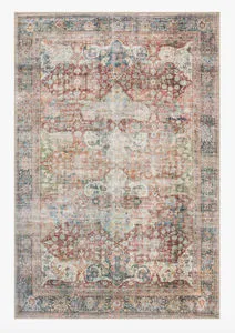full overhead view of rectangular rug showing overall colorful faded vintage floral and geometric design