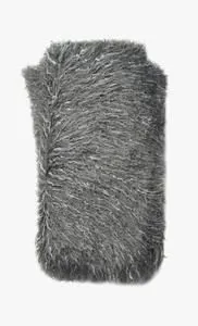 Soft grey cotton throw with a shaggy texture and a plush, cozy feel