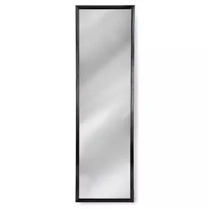 Tall rectangular dressing room mirror with slim black frame and clear reflective surface
