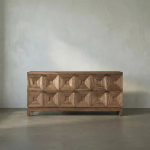 Dark walnut 6-drawer console table with faceted pyramidal drawer fronts and minimal brass pulls on a defined base