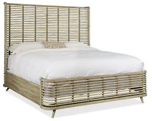 Queen-size rattan bed with high open-weave headboard and low footboard in light driftwood finish