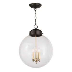 circular glass globe pendant light with three candle-style bulbs inside a dark metal frame and chain suspension