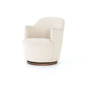 Three-quarter side view of small upholstered swivel chair in natural bouclé fabric