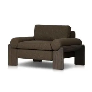 Joette Outdoor Chair with heavy wood frame and deep brown textured fabric upholstery, featuring loose bolsters and wide legs