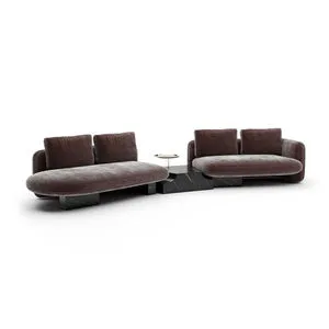 Overlap Left Bumper Sectional with chocolate velvet cushions, rounded shapes, and black marble-inspired base with integrat...