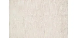 Close-up top view showing fine texture and shimmer of Serena Ivory Rug fibers