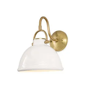 Eloise ceramic sconce with white bell-shaped shade and natural brass curved arm and wall mount
