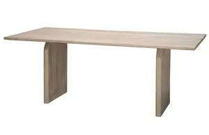 Rectangular mango wood dining table with thick arched legs and a natural light wood finish