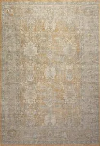 Rectangular traditional rug in gold and sand tones with vintage-inspired intricate medallion pattern