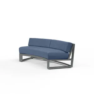 Redondo Curved Sofa with low back, blue cushions, and brushed slate powder coated aluminum frame