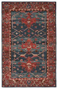 Hand-tufted traditional rug with ornate medallion motif in rust, deep blue and beige, richly distressed Turkish design