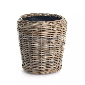 Tightly woven rattan outdoor planter basket with a tapered round shape and visible black plastic liner inside