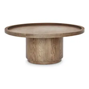 Cohen coffee table in solid oak with tray-style round top and cylindrical pedestal base in rich brown finish