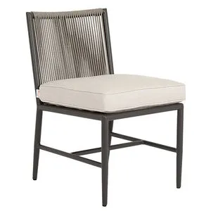 Pietra Armless Dining Chair with matte graphite aluminum frame and shale-colored all-weather rope back, beige cushion on seat