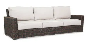 Montecito Sofa in Cognac multi-colored resin wicker with white cushions, outdoor 3-seat sofa with armrests